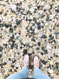 Low section of person standing on rock