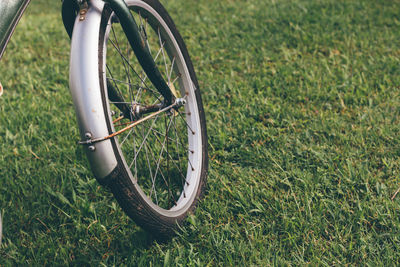 Some of the bicycles are parked in the garden.parts of the bike.bicycle wheel part, close up details