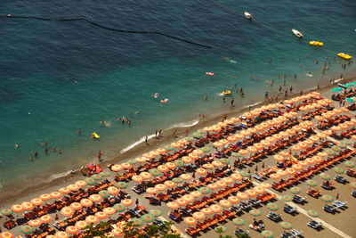 High angle view of people and parasols at beach