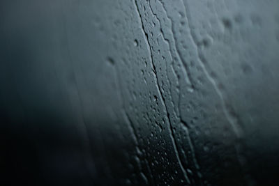 Full frame shot of wet window in rainy season