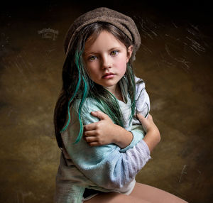 Portrait of girl with arms crossed