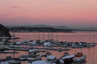 High angle view of boats moored at harbor