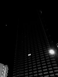 Low angle view of illuminated street light at night