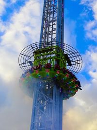 Low angle view of ferris wheel against sky