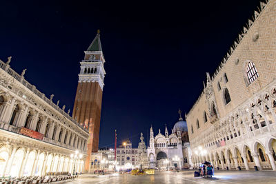 Buildings in city at night