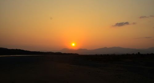 Scenic view of landscape at sunset