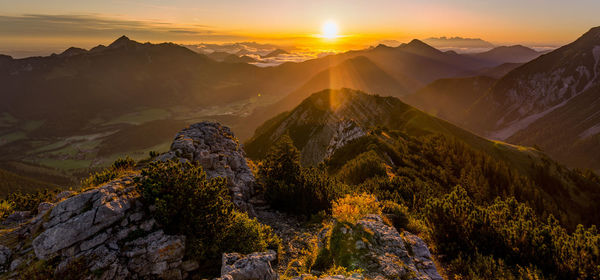 Scenic view of mountains against sky during sunset