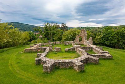 Mecseknadasd, hungary - aerial view about schlossberg church ruins surrounded by forest.