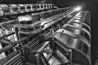 Low angle view of illuminated factory at night