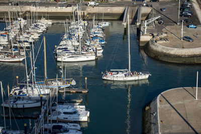 Boats moored at harbor