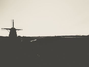 Traditional windmill against clear sky