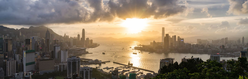 Panoramic view of city buildings during sunset