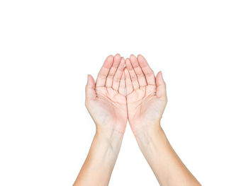 Close-up of hand against white background