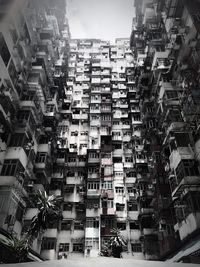 Low angle view of buildings in city against sky
