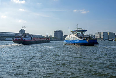 The harbor from amsterdam with the central station in the netherlands