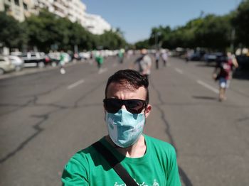 Portrait of man wearing mask standing outdoors