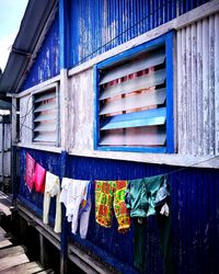 Low angle view of clothes drying outside building