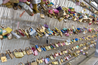 Padlocks hanging on railing