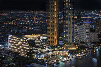 High angle view of illuminated city buildings at night