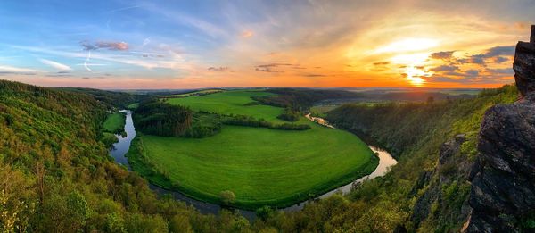 Scenic view of landscape against sky during sunset