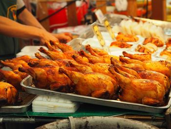 Close-up of hand holding meat in market