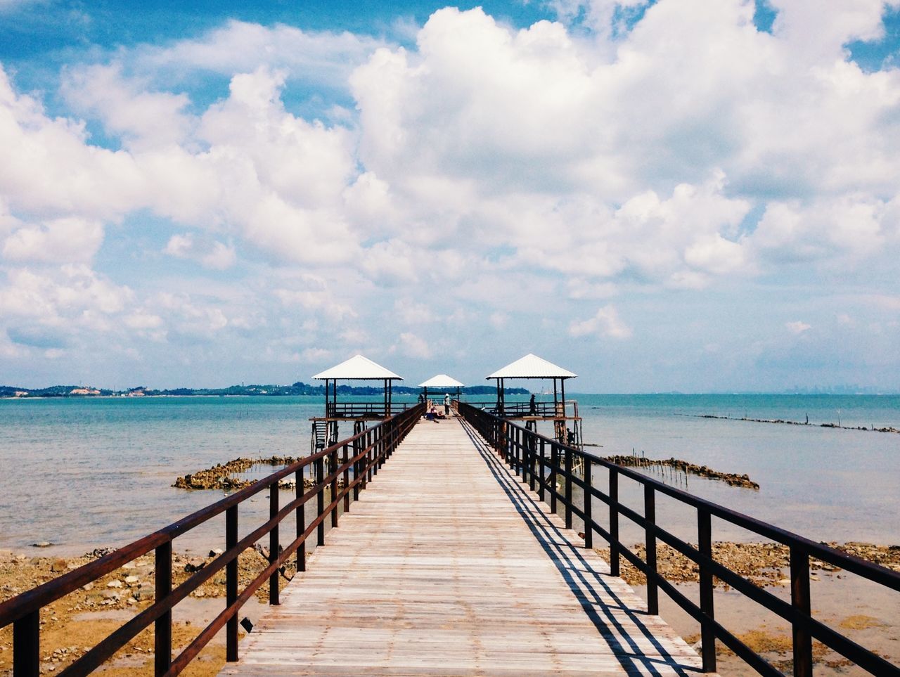 the way forward, sea, water, pier, sky, railing, diminishing perspective, horizon over water, jetty, tranquil scene, tranquility, long, vanishing point, cloud - sky, scenics, boardwalk, cloud, built structure, wood - material, beauty in nature