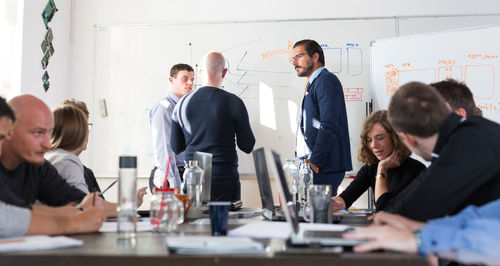 Business colleagues working in office