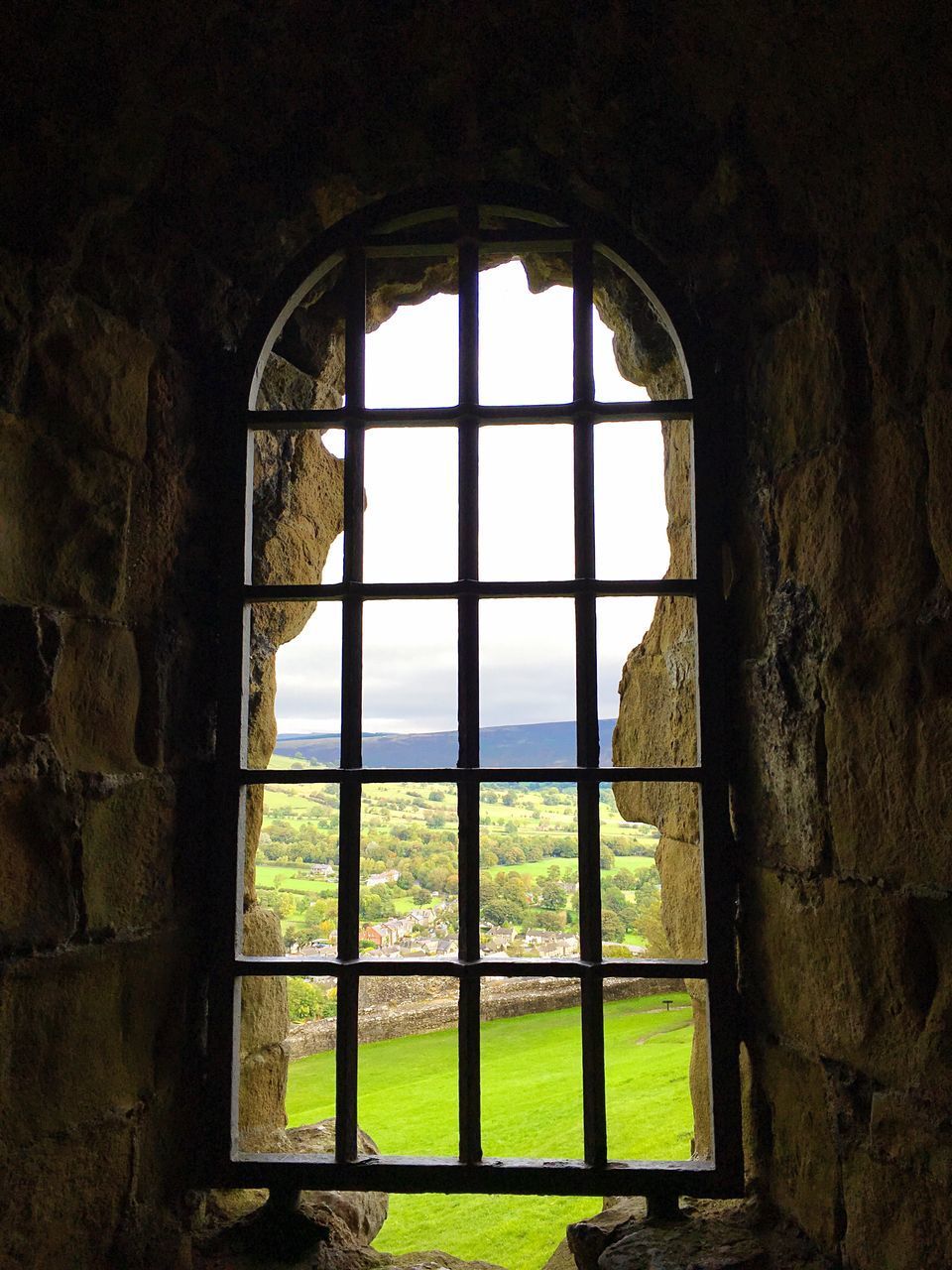 VIEW OF HISTORIC BUILDING THROUGH WINDOW