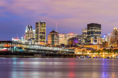 Illuminated city at waterfront