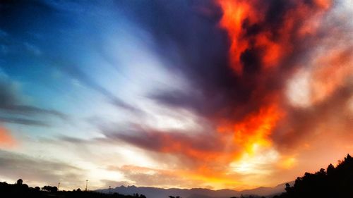 Low angle view of dramatic sky during sunset