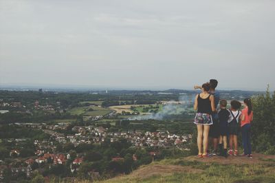 Rear view of woman looking at cityscape