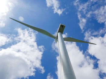 Low angle view of traditional windmill against sky