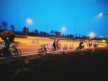 People on bicycle at night