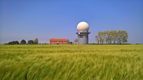 Built structure on field against clear sky