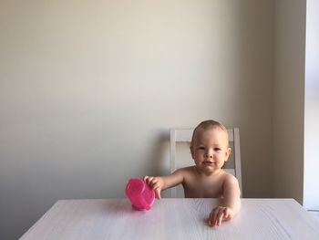 Portrait of infant at table