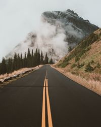 Country road leading towards mountains