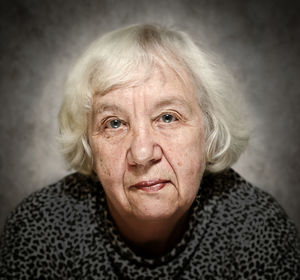 Close-up portrait of woman at home