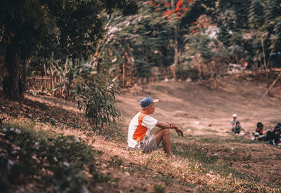 Man sitting in forest