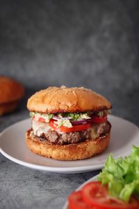 Close-up of burger in plate on table