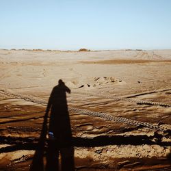 Shadow of man on desert