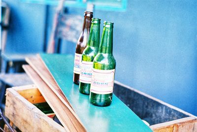 Close-up of wine bottles on table