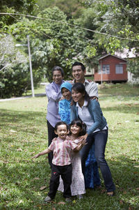 Happy multi-generation family playing in park