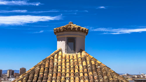 Low angle view of building against blue sky