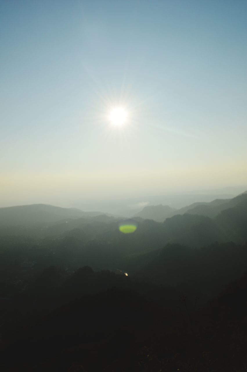 SCENIC VIEW OF MOUNTAINS AGAINST SKY AT SUNSET