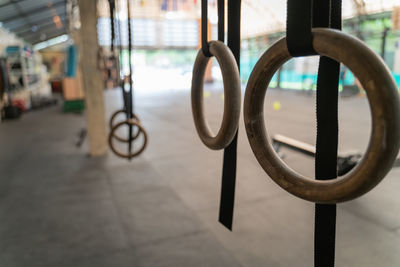 Close-up of gymnastic rings in gym