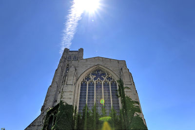 Low angle view of building against blue sky