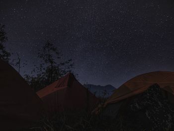 Camping on the mountain peak among sky full of stars