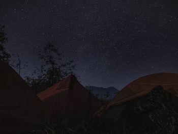 Low angle view of tent against sky at night