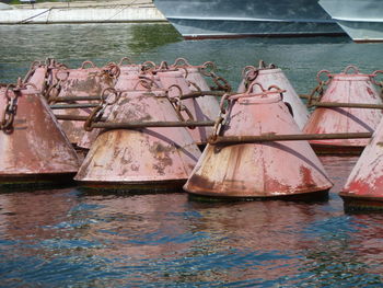 Abandoned boats moored in lake
