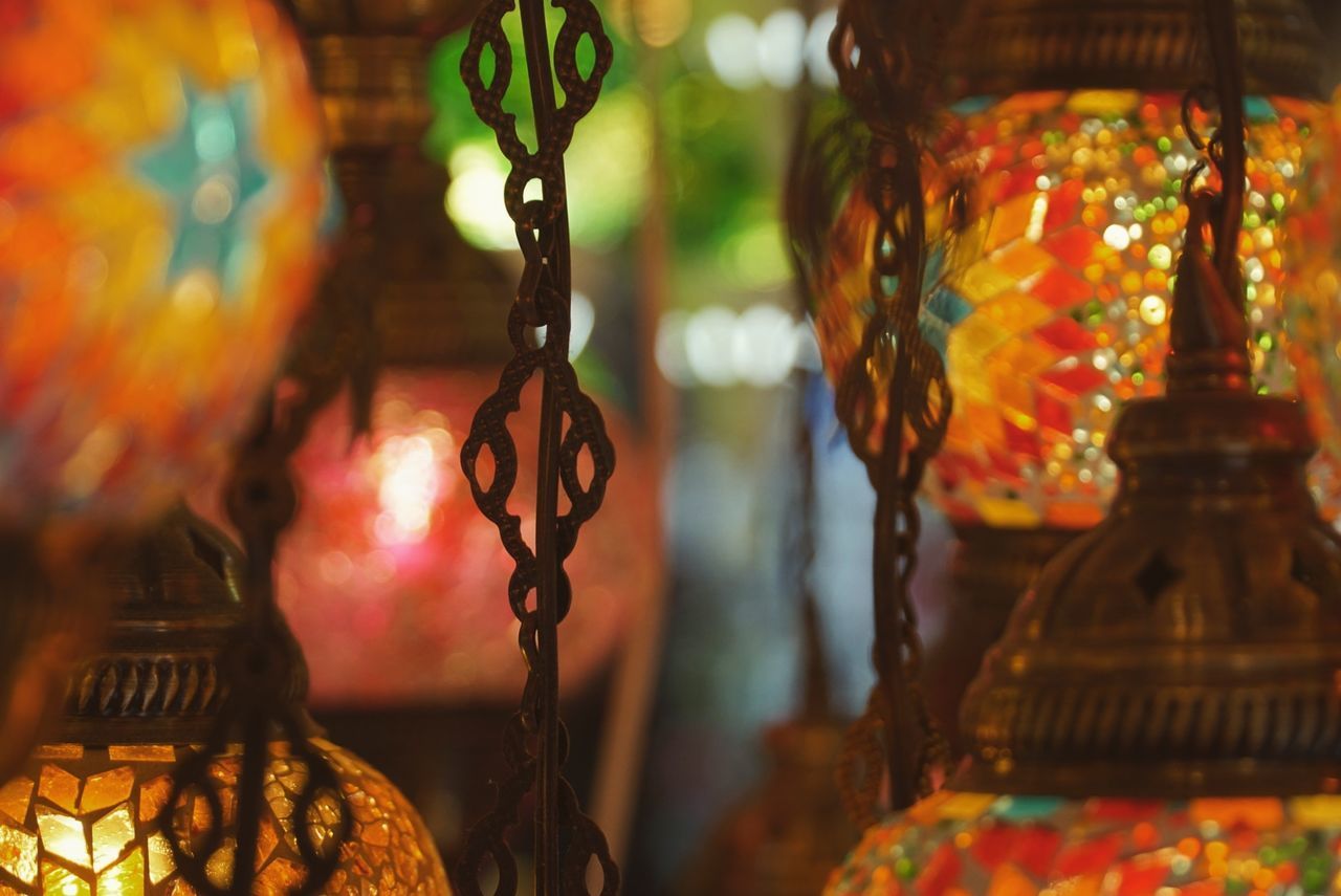 CLOSE-UP OF LANTERNS HANGING AT MARKET